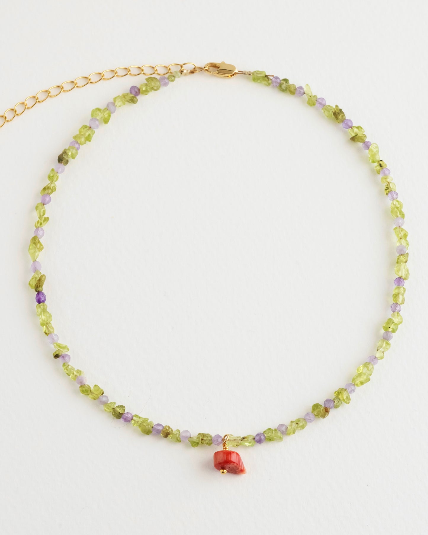 amethyst and olivine crystal necklace with a coral pendant