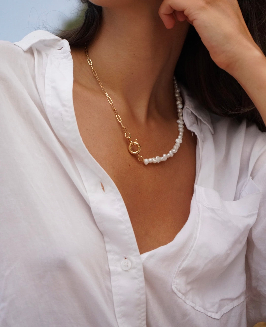 Girl with natural pearls and 24K gold Rocap Jewelry necklace with sailor clasp and white shirt