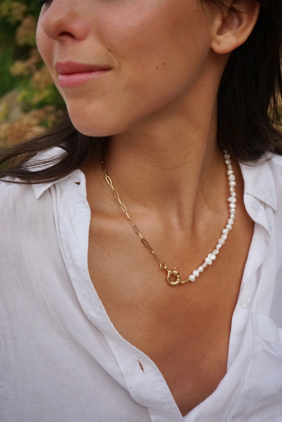 Girl with natural pearls and gold necklace with sailor clasp 