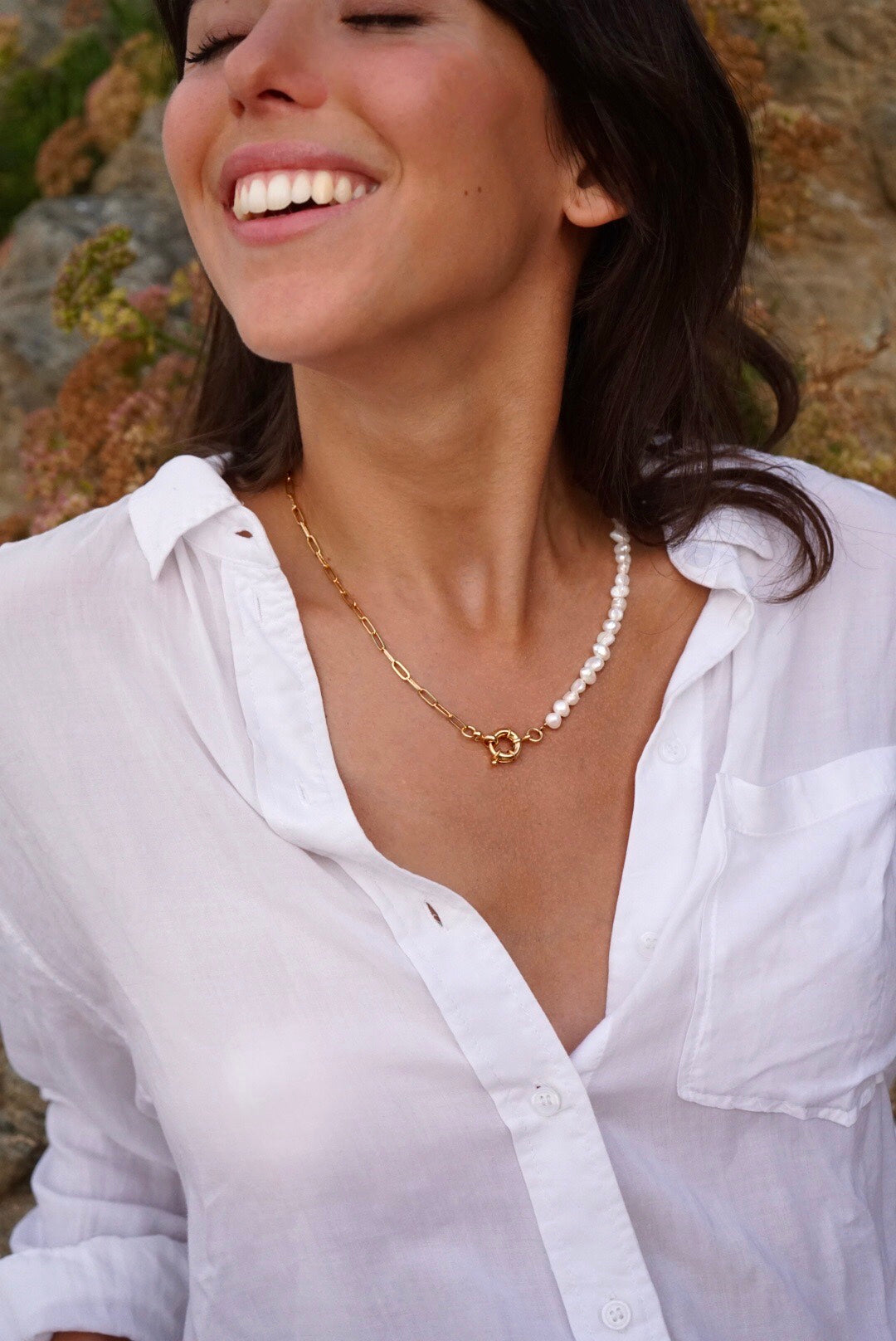 Girl laughing with natural pearls and 24K gold Rocap Jewelry necklace with sailor clasp and white shirt 