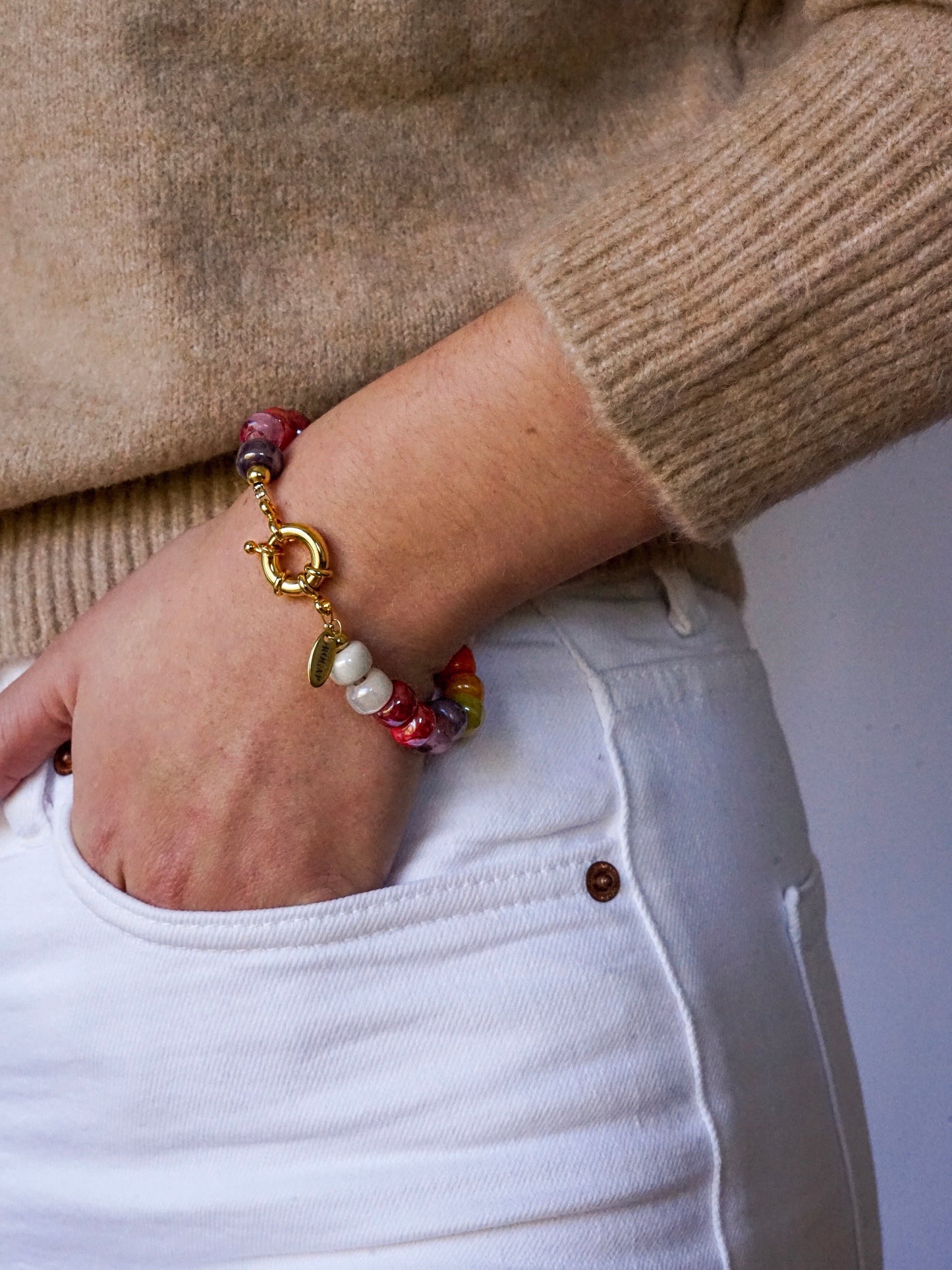 Recycled crystal beads bracelet with a 24k gold-plated toggle clasp.