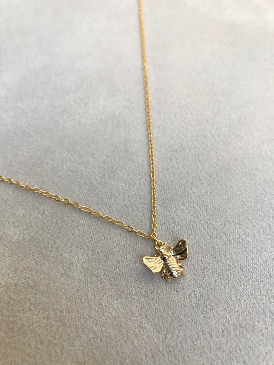 Golden bee in gold chain