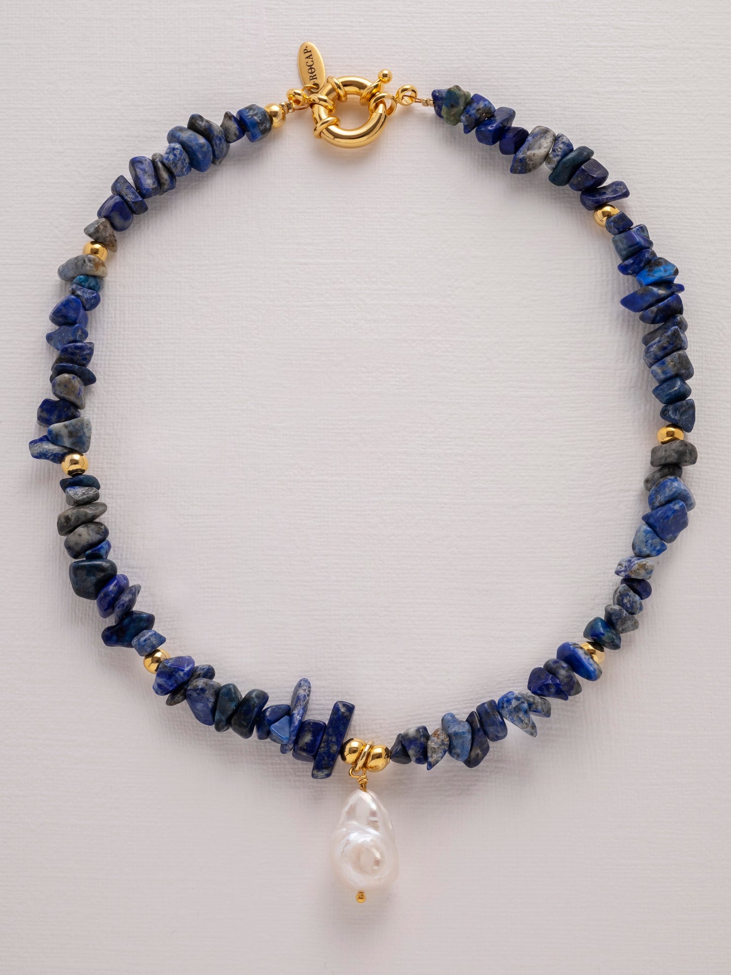 Lapis lazuli chips necklace with freshwater baroque pearl finished with a gold-plated sailor clasp.