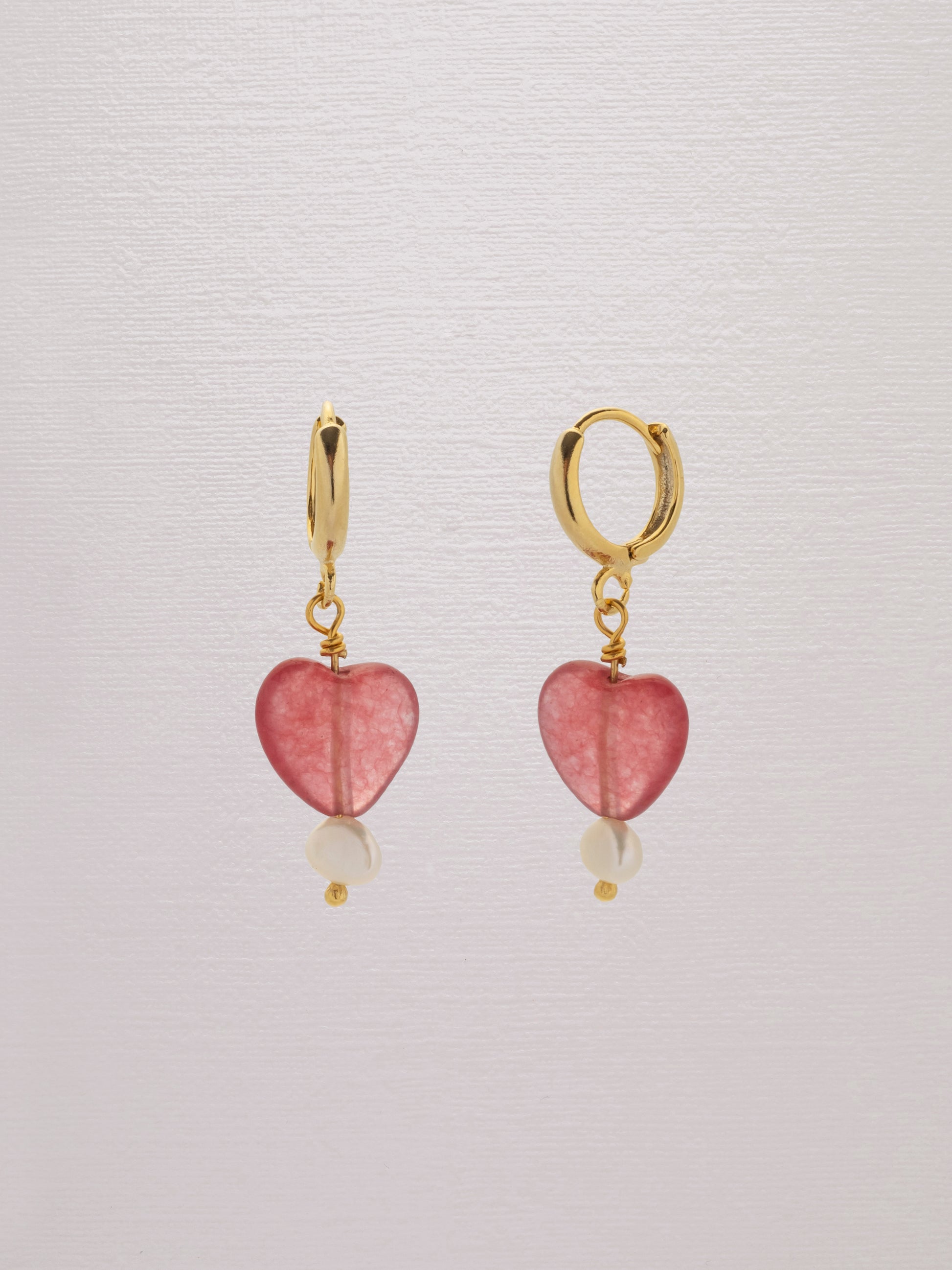 Red gemstone heart earring with a freshwater pearl and 24k gold-plated hoop.